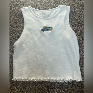 white tank top with car and flowers